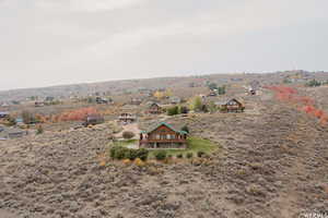 Birds eye view of property with a rural view