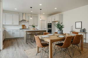 Dining area with light wood-type flooring