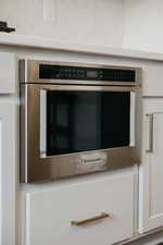 Details with oven and white cabinets