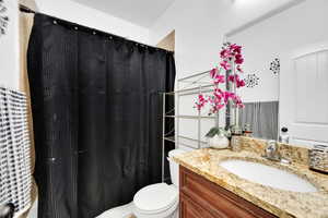 Bathroom with vanity and toilet