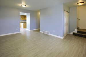 Living room with light wood-type flooring