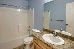 Full bathroom with vanity,  shower combination