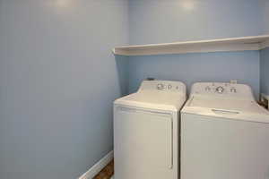 Laundry room with washing machine and dryer