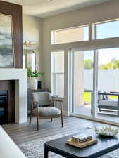 Doorway featuring a textured ceiling and hardwood / wood-style flooring