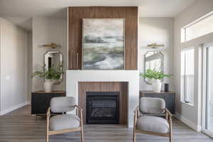 Living area featuring plenty of natural light and hardwood / wood-style flooring