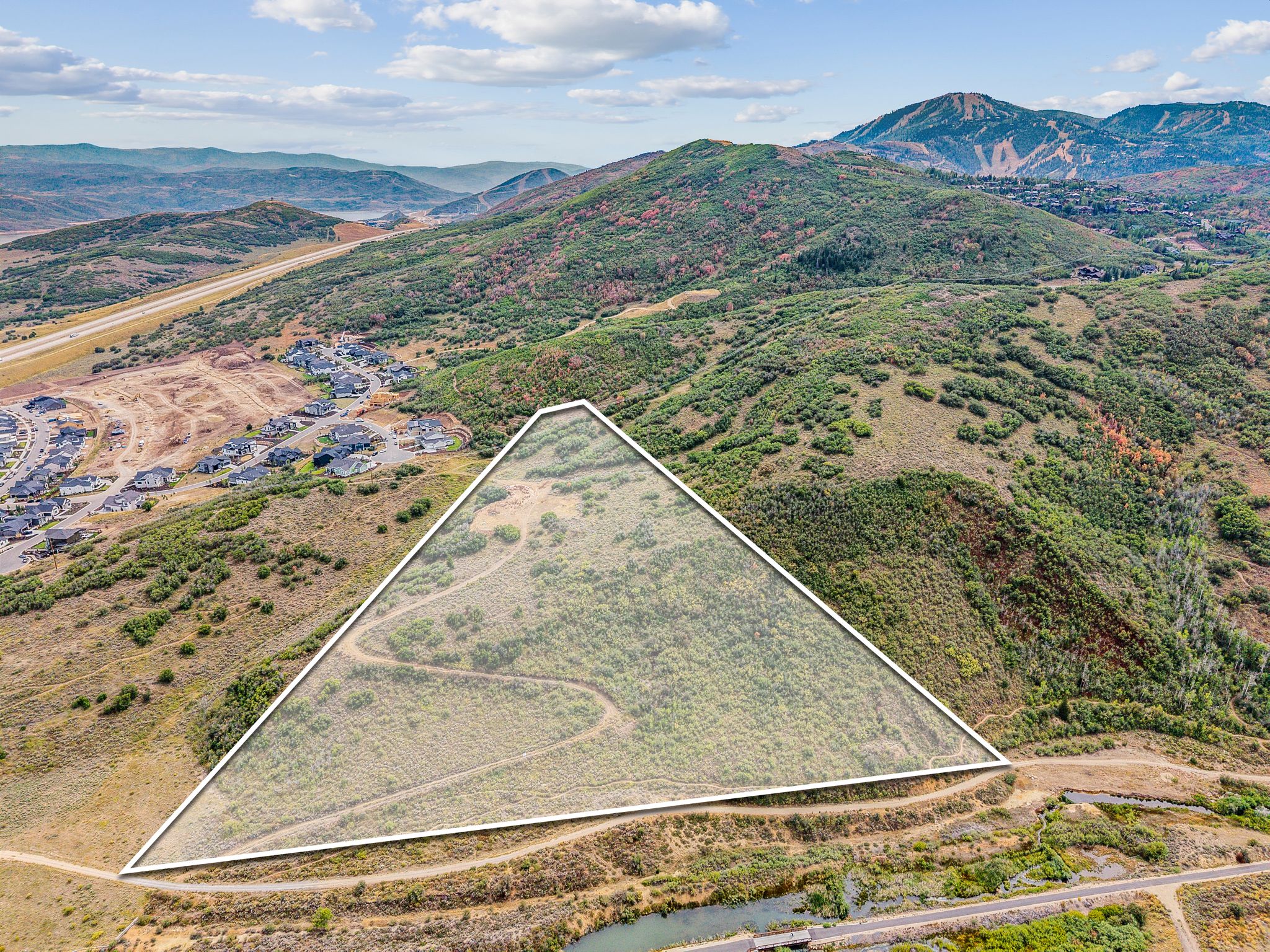 View of rural area featuring property parcel outlined and a mountain backdrop