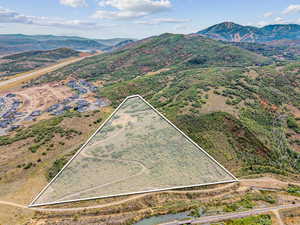 View of rural area featuring property parcel outlined and a mountain backdrop