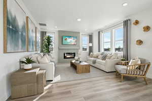 Living room with light hardwood / wood-style flooring