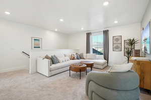 Living room with light colored carpet