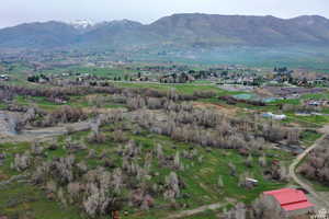 Birds eye view of property featuring a mountain view and a rural view