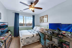 Bedroom with carpet flooring and ceiling fan