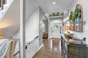 Foyer entrance with dark hardwood / wood-style flooring