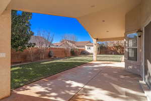 View of patio featuring a shed