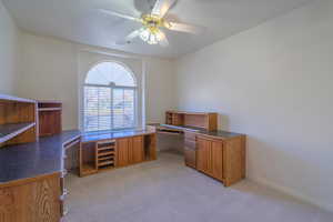 Office featuring ceiling fan and light colored carpet