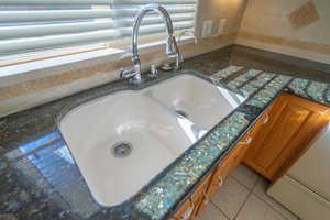 Interior details with sink and dark stone counters