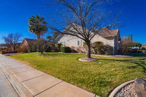 View of home's exterior with a lawn