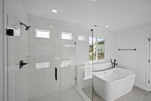 Bathroom featuring tile patterned floors and independent shower and bath