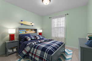 Bedroom featuring light colored carpet