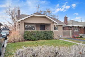 View of front of house featuring a front lawn