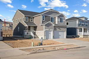 View of front facade featuring a garage