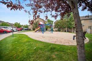 View of play area featuring a yard