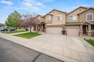 View of front of property featuring a garage