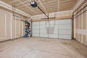 Garage featuring a garage door opener