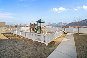 View of yard with a playground and a mountain view