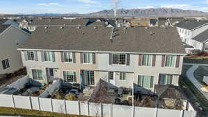 Back of property featuring a mountain view