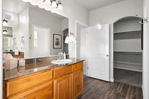 Bathroom with vanity and hardwood / wood-style flooring