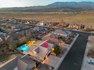 Birds eye view of property with a mountain view