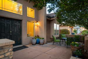 Property entrance with a patio area