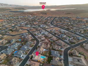 Birds eye view of property with a water and mountain view