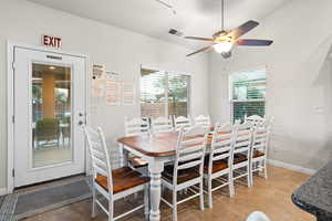 Tiled dining area with ceiling fan