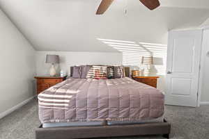 Bedroom featuring ceiling fan and carpet floors