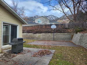 View of patio with a mountain view and grilling area