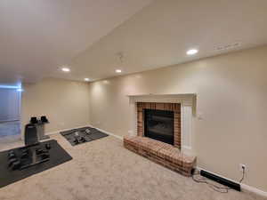 Carpeted living room featuring a fireplace