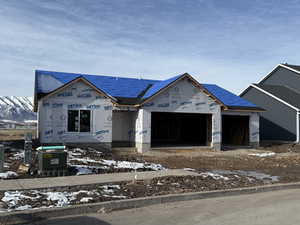 Property in mid-construction with a garage