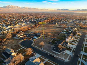 Birds eye view of property with a mountain view