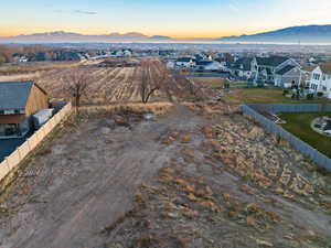 Aerial view at dusk featuring a mountain view