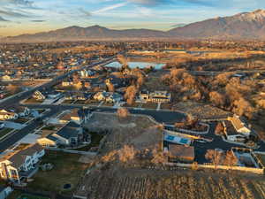 Aerial view featuring a water and mountain view