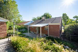 Rear view of property featuring a patio area