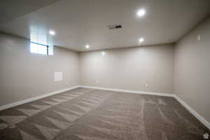 Basement featuring carpet flooring