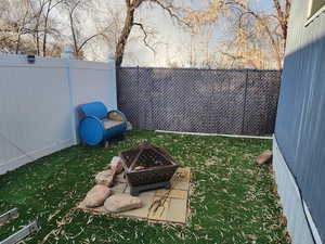 View of yard featuring a fire pit