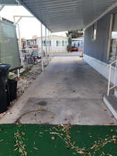 View of patio featuring a carport