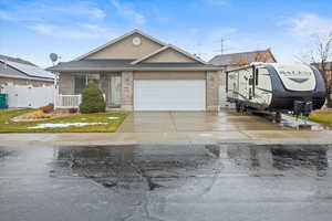 Single story home featuring a garage