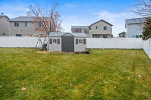 View of yard with a storage shed