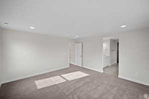 Unfurnished room with light colored carpet