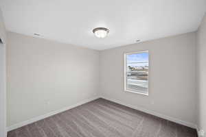 View of carpeted spare room