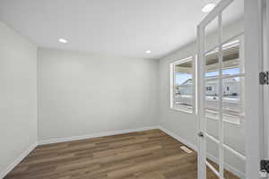 Spare room featuring dark hardwood / wood-style floors